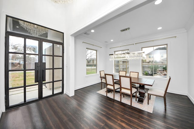 dining room featuring baseboards, dark wood-style flooring, recessed lighting, and crown molding