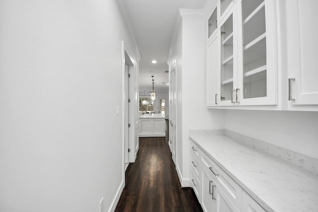 corridor with recessed lighting, dark wood finished floors, and baseboards