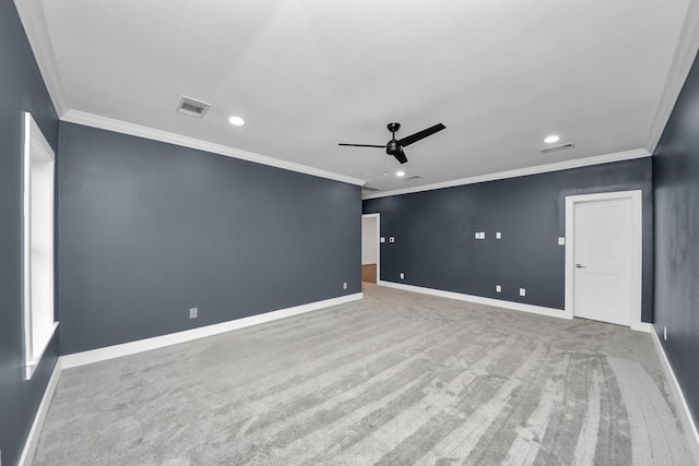 empty room with visible vents, ceiling fan, and baseboards