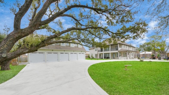 view of front of property featuring a garage and a front lawn