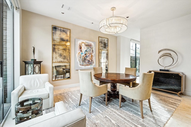 dining area featuring a chandelier