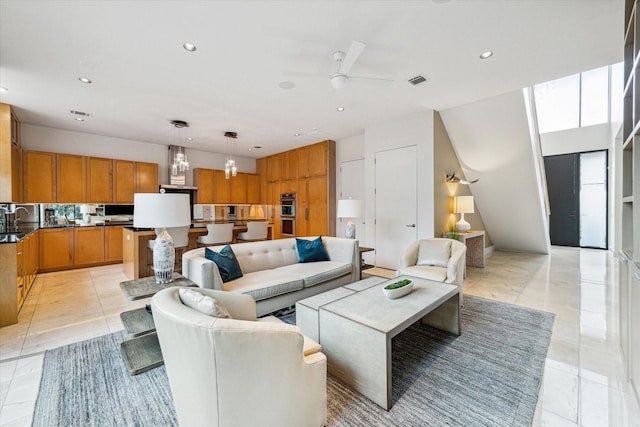 living room featuring ceiling fan and light tile patterned flooring