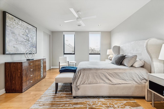 bedroom featuring ceiling fan and light hardwood / wood-style floors