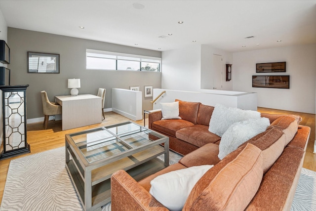 living room with light hardwood / wood-style flooring