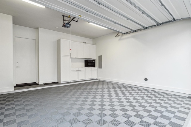 garage featuring a garage door opener and electric panel