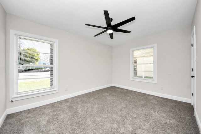 unfurnished room with carpet, ceiling fan, and baseboards