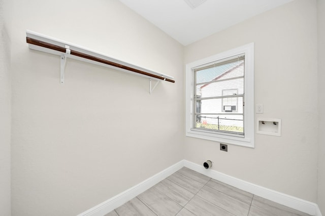 laundry area featuring baseboards, laundry area, washer hookup, and hookup for an electric dryer