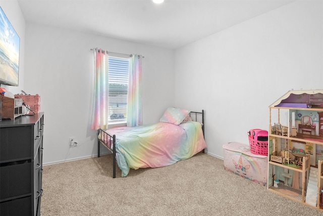 bedroom with light carpet