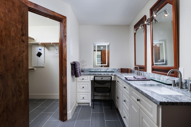 bathroom with vanity and tile patterned flooring