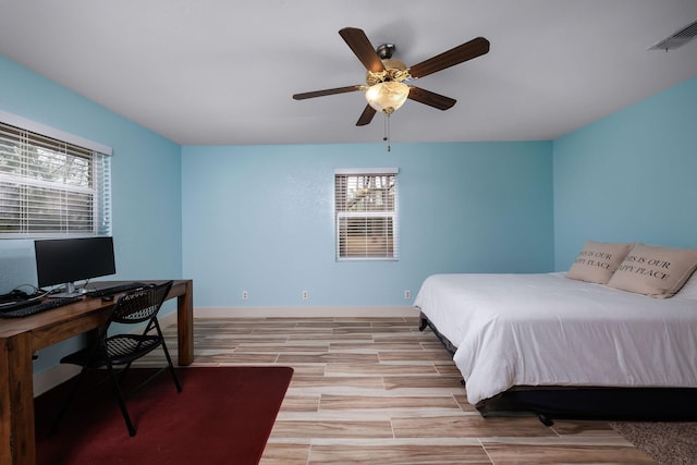 bedroom with ceiling fan and light wood-type flooring