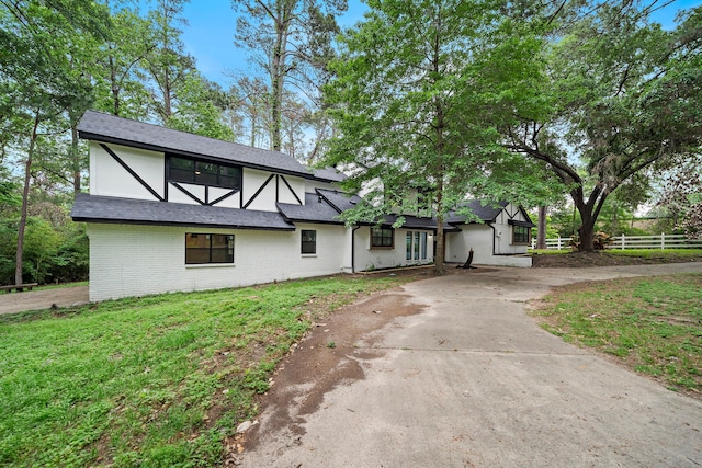 tudor house with a front yard