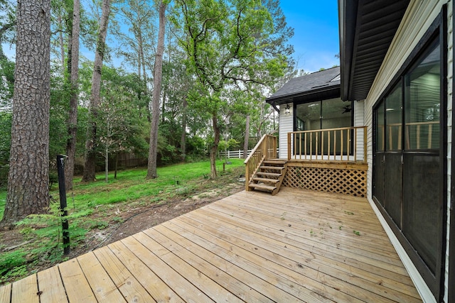 wooden deck with ceiling fan