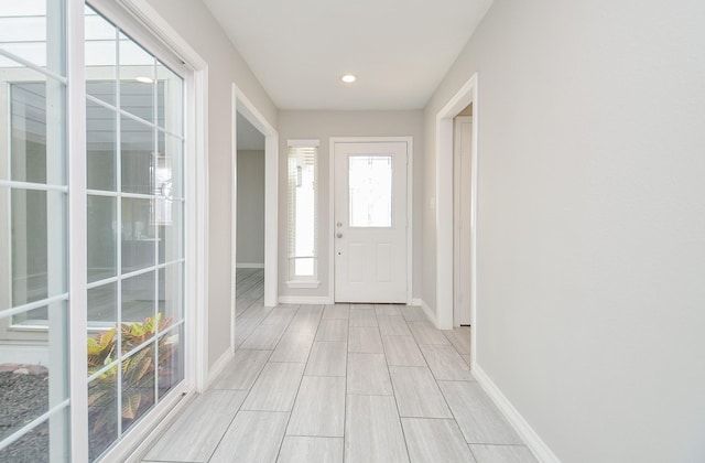 foyer featuring baseboards