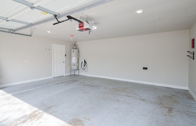 garage with a garage door opener, water heater, and baseboards