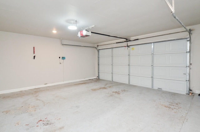 garage featuring baseboards and a garage door opener