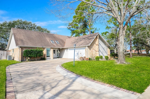 view of front of home with a garage, brick siding, driveway, and a front lawn