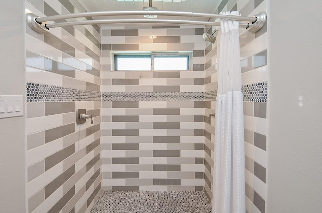 bathroom with a shower stall