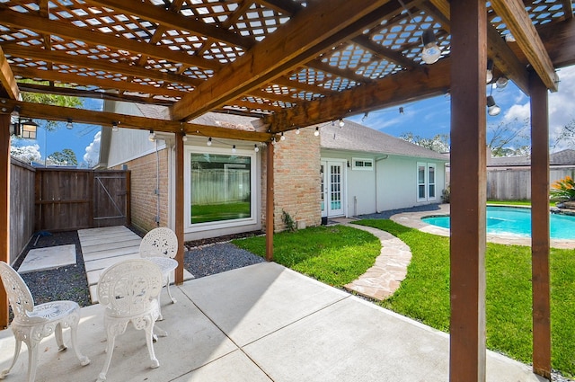 view of patio featuring fence, a fenced in pool, and a pergola