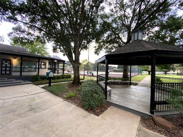 surrounding community featuring fence and a gazebo