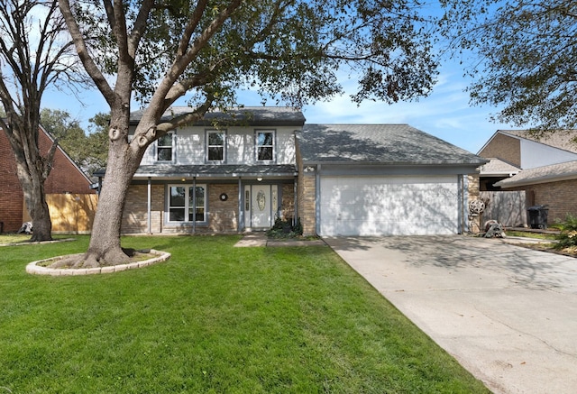 front facade featuring a garage and a front yard