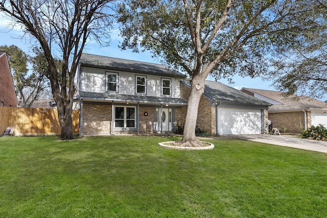 view of front facade featuring a garage and a front yard