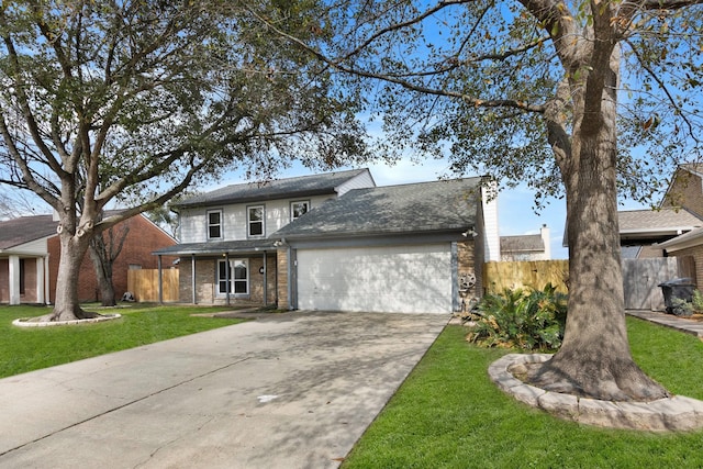 view of property with a garage and a front yard