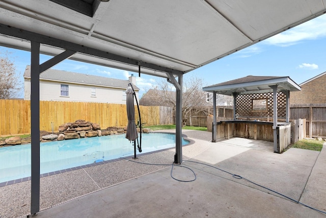 view of patio with a gazebo and a bar