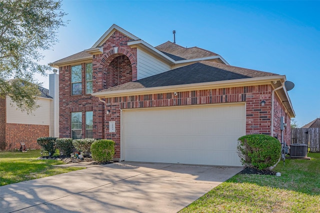 traditional-style home featuring brick siding, central AC unit, an attached garage, and a shingled roof