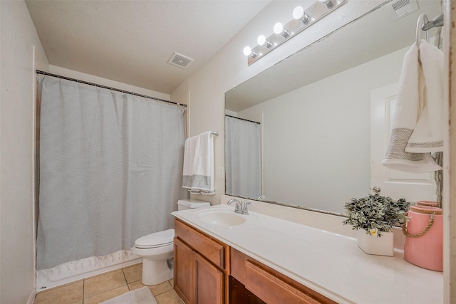 bathroom featuring tile patterned floors, visible vents, toilet, and vanity