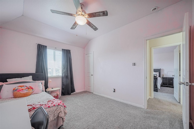 bedroom with vaulted ceiling, a ceiling fan, baseboards, and carpet floors