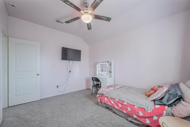 bedroom featuring vaulted ceiling, carpet flooring, visible vents, and ceiling fan