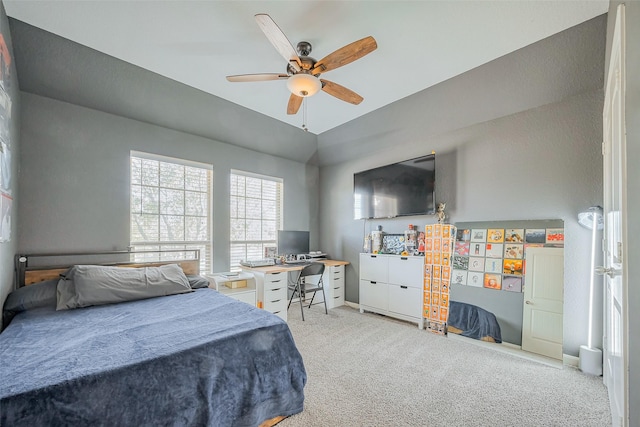 bedroom with baseboards, lofted ceiling, ceiling fan, and carpet flooring