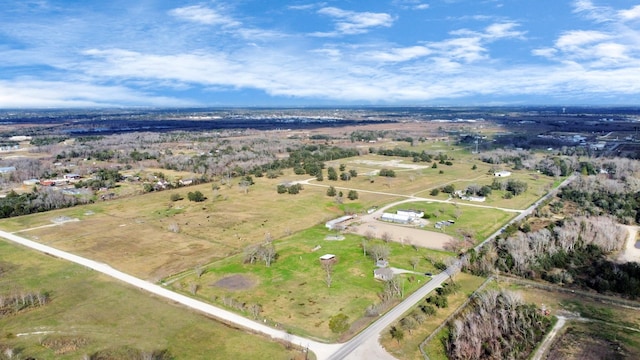 birds eye view of property with a rural view