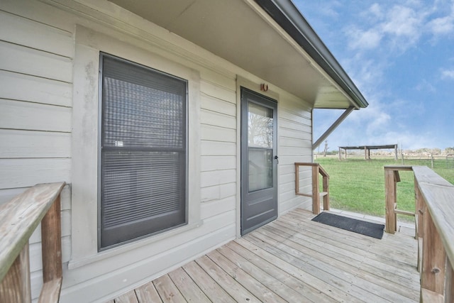 wooden terrace with a yard