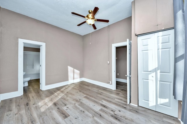 unfurnished bedroom featuring a closet, ceiling fan, and light wood-type flooring