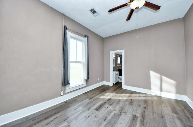 unfurnished room with light hardwood / wood-style flooring and ceiling fan