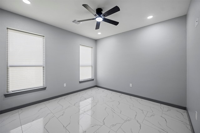 spare room featuring ceiling fan