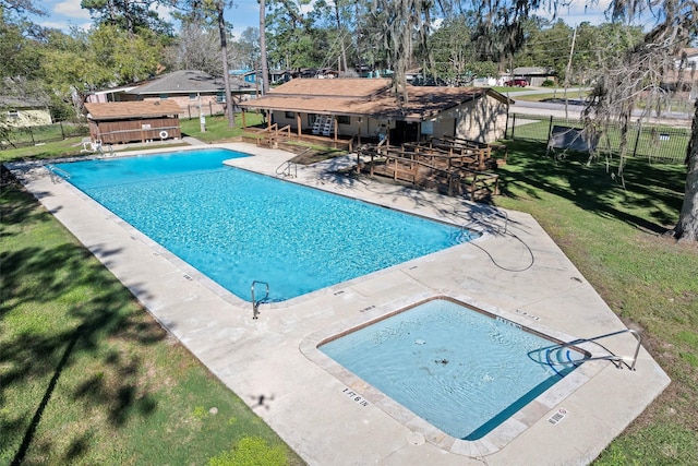 view of pool with a yard and a patio area