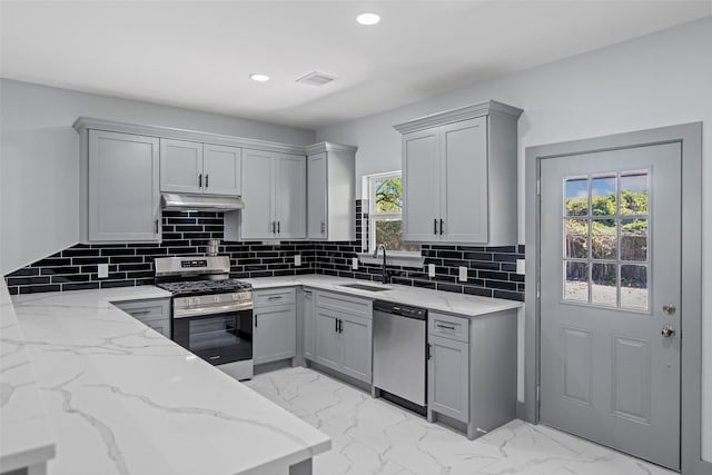 kitchen featuring sink, gray cabinets, and stainless steel appliances