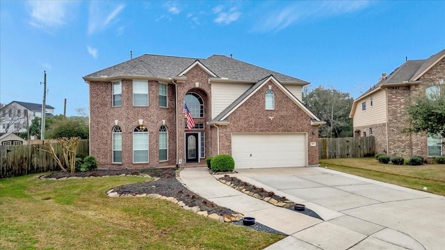 front of property with a garage and a front lawn