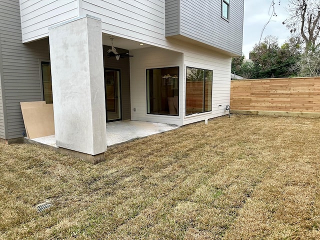 exterior space featuring ceiling fan