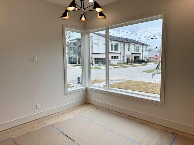 unfurnished dining area featuring hardwood / wood-style flooring