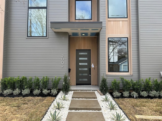 property entrance with a yard