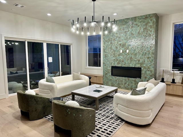 living room featuring a fireplace and light hardwood / wood-style floors