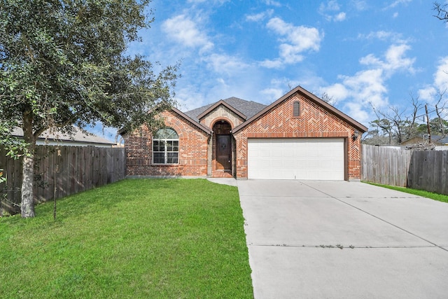 view of front of house featuring a garage and a front yard