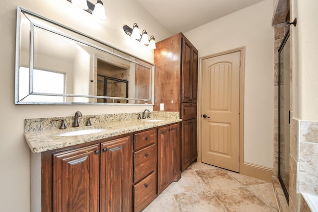 bathroom featuring vanity and an enclosed shower