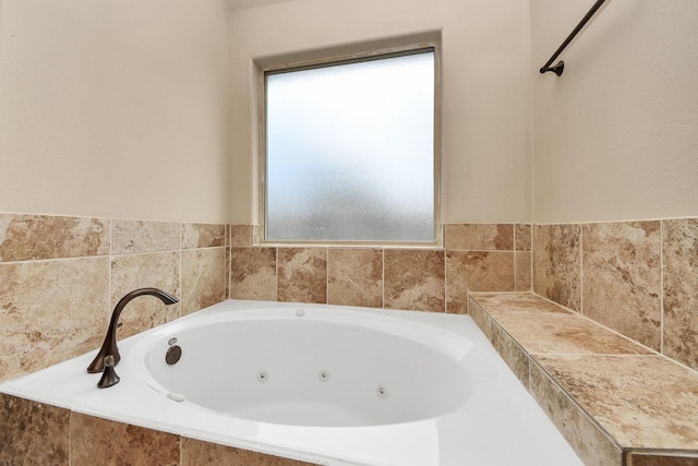 bathroom featuring tiled bath