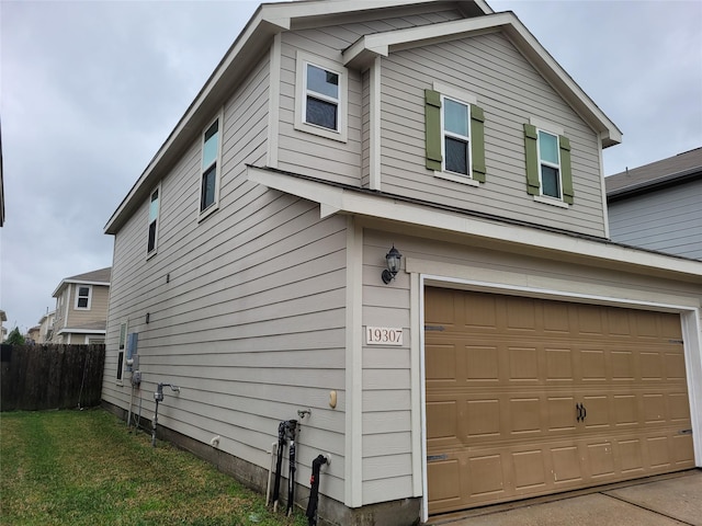 view of side of property featuring a garage