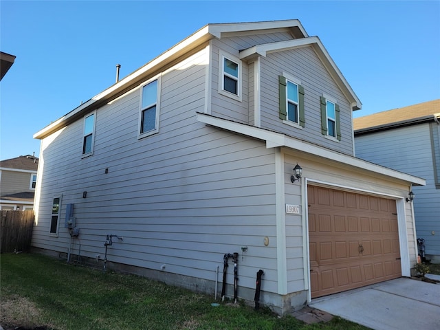 view of side of home with an attached garage