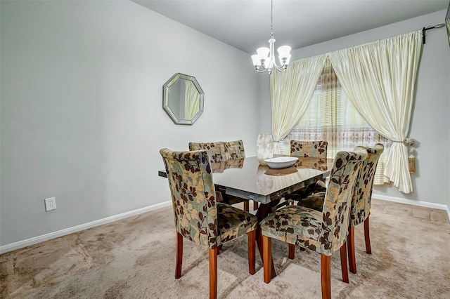 dining area featuring light colored carpet and a notable chandelier